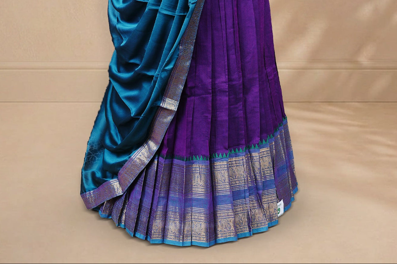 Purple colour Half saree featuring Plain skirt with Zari border on contrast Teal colour border, Unstitched Blouse and matching dupatta.