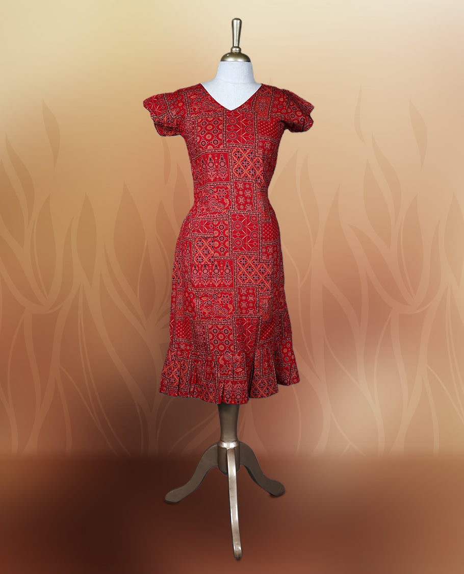 Red colour nightwear with traditional patch style prints in black and white, Features a V neck, puff sleeves, and a ruffled flared hem, A stylish pick for festive occasions, casual wear, or ethnic flair.