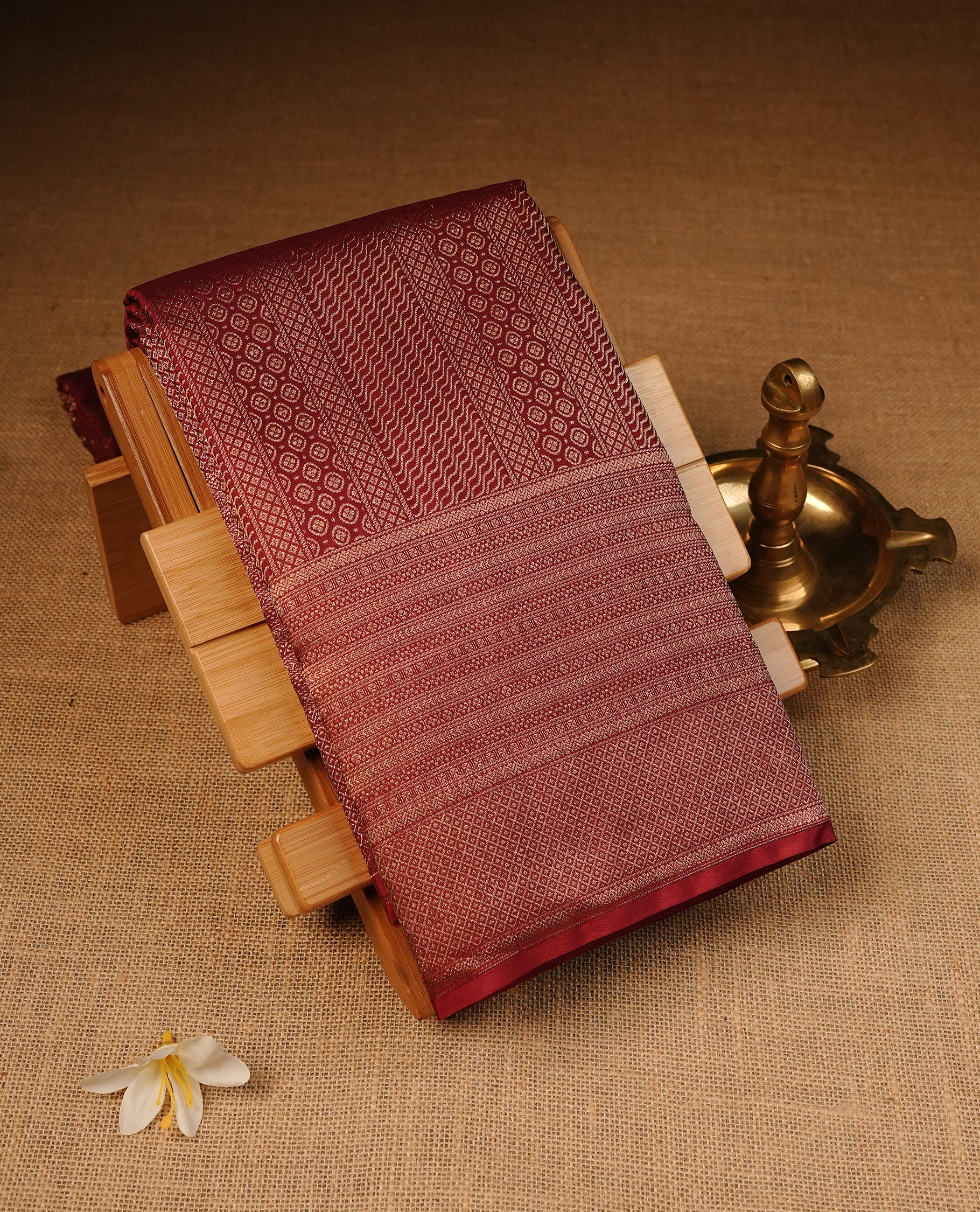 Vintage Maroon Colour Wedding silk saree Featuring Gold Zari Pattern on Body, Finished with Self colour With Traditional border, Comes with Matching Blouse Piece.