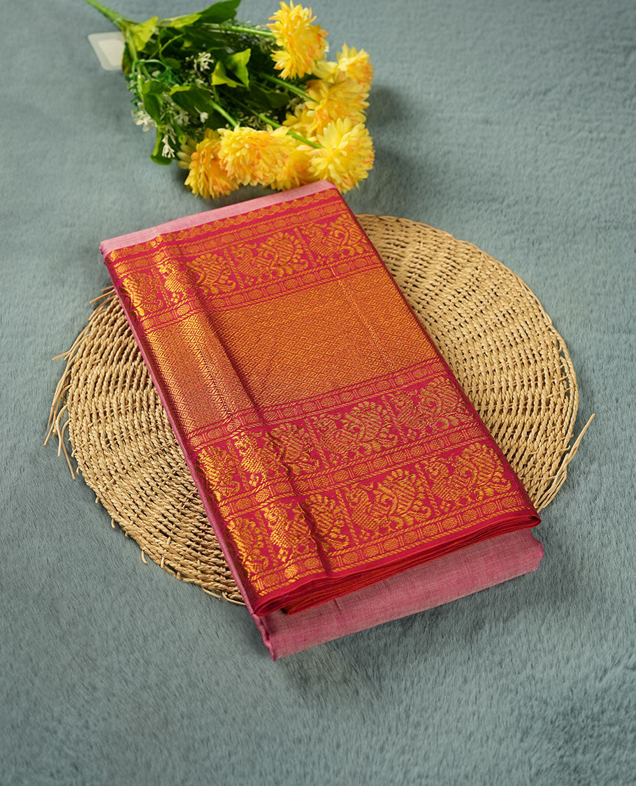 Pink colour Narayanapattu cotton saree featuring a self coloured body, contrast Rani pink colour with gold zari border and pallu, pairing a matching blouse piece.
