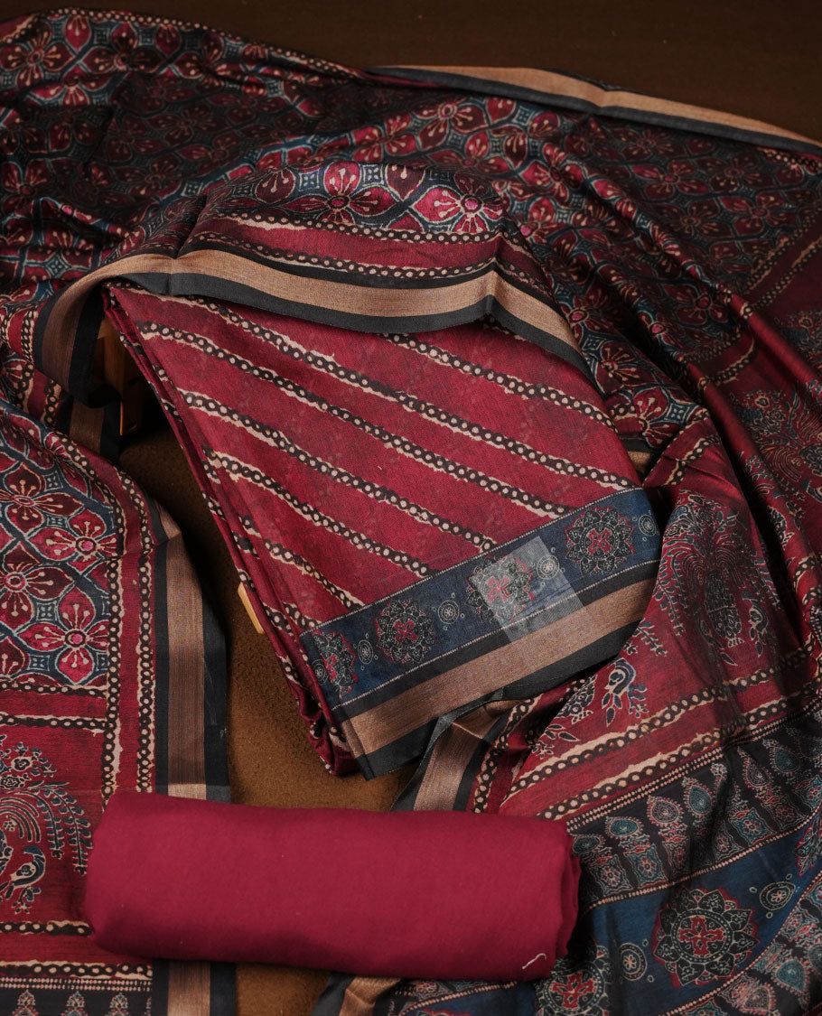 Maroon colour churidar material featuring a striped printed body, paired with an intricately printed dupatta and a matching solid bottom.