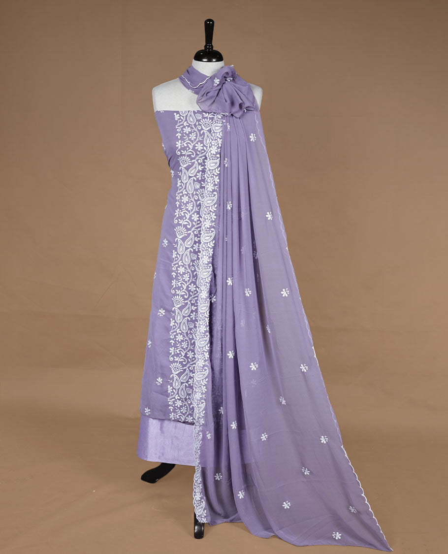 Lavender colour churidar material featuring white thread floral pattern on body, paired with matching bottom and dupatta.
