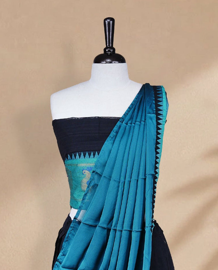 Black colour Half saree featuring Plain skirt with Zari border on contrast Aqua colour border, Unstitched Blouse and matching dupatta.