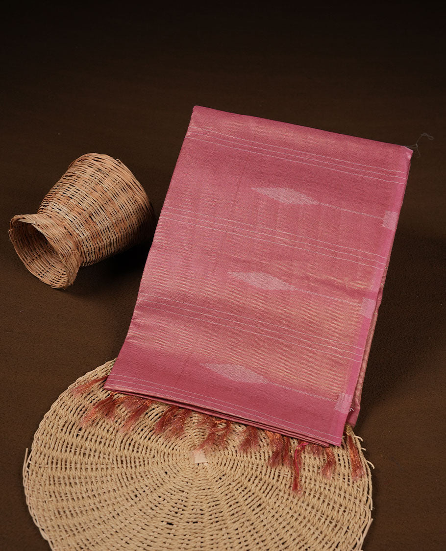 Pink colour semi jute saree highlighting gold zari stripped body with white motifs, without border and paired with matching blouse.