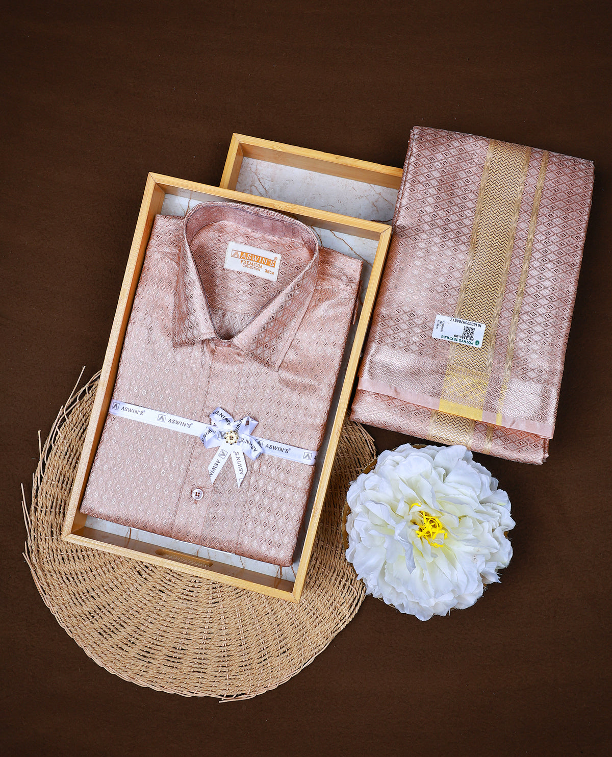 Rose Gold colour ASWIN'S shirt paired with a matching dhoti, finishing with a Gold kara