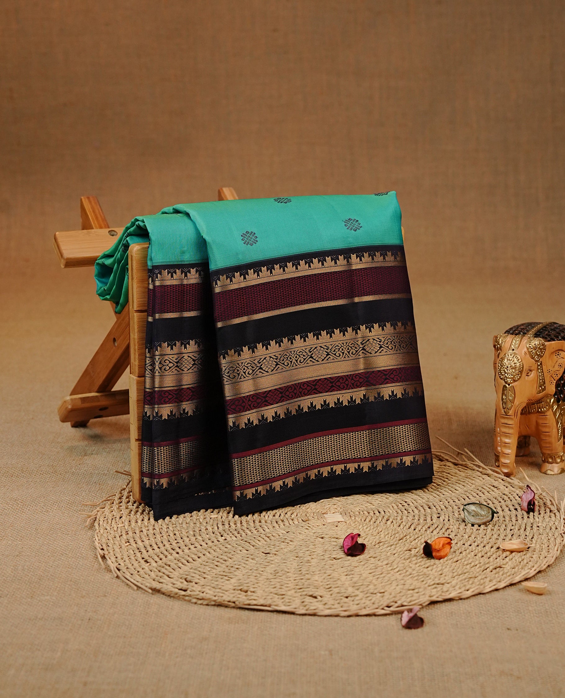 Blue & Green double shade colour Kancheepuram silk saree featuring Motifs on body, complemented by Multicolour with Traditional border, comes with matching blouse piece.
