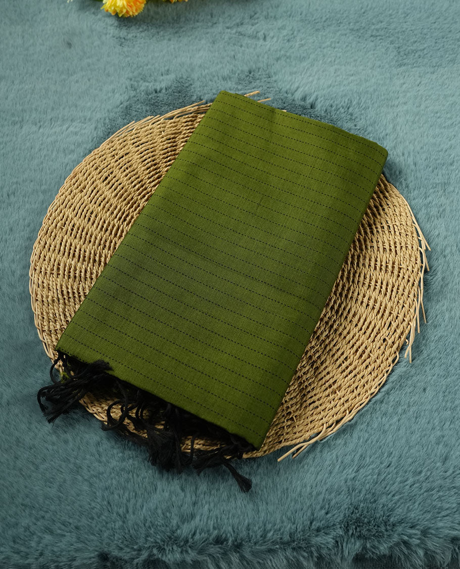 Olive Green colour poly cotton saree with black vertical dotted line pattern on the body, paired with a matching pallu featuring black zigzag geometric border, and a coordinated all‑over black stylised fleur‑de‑lis printed blouse piece.