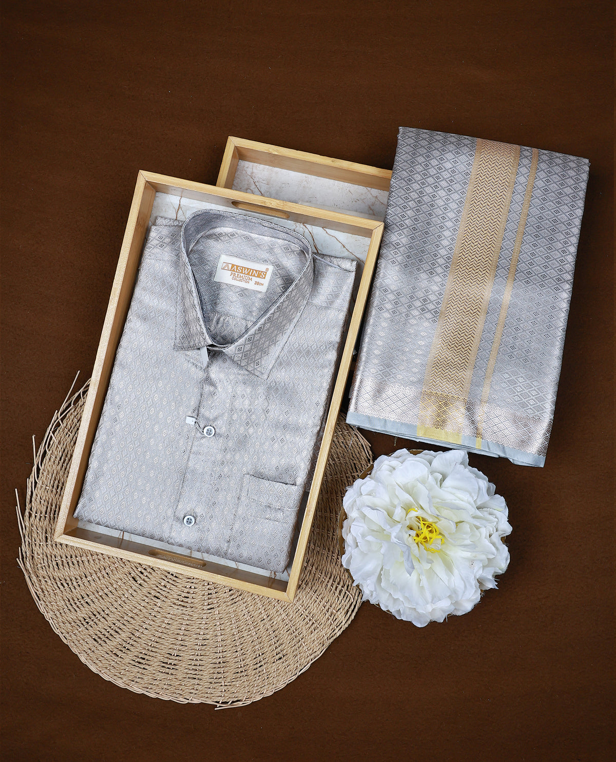 Grey colour ASWIN'S shirt paired with a matching dhoti, finishing with a Gold border