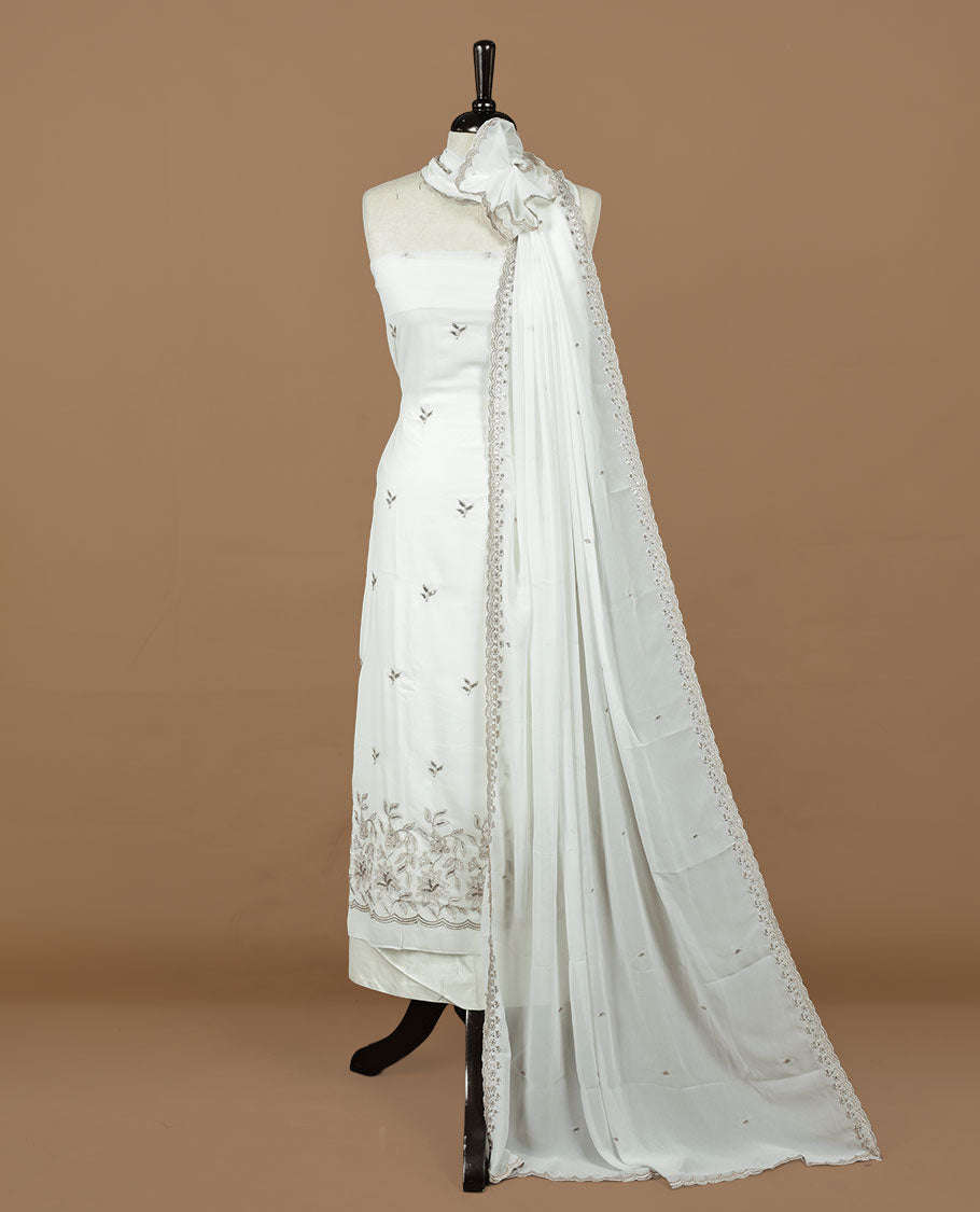 White colour churidhar material featuring gold thread floral pattern on body, paired with matching bottom & dupatta.