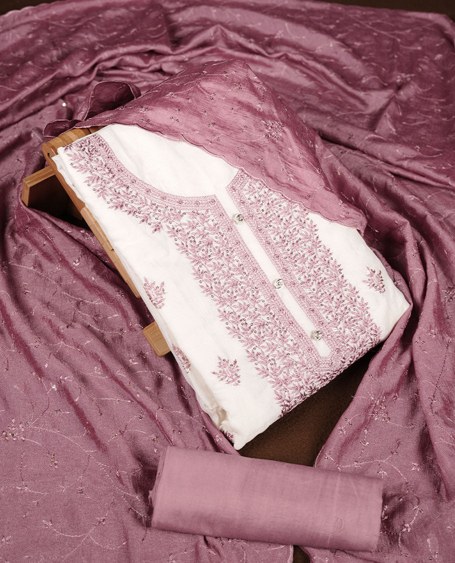 Ivory colour churidar material with soft pink colour thread embroidery on the front panel, paired with a matching blush pink dupatta and bottom.