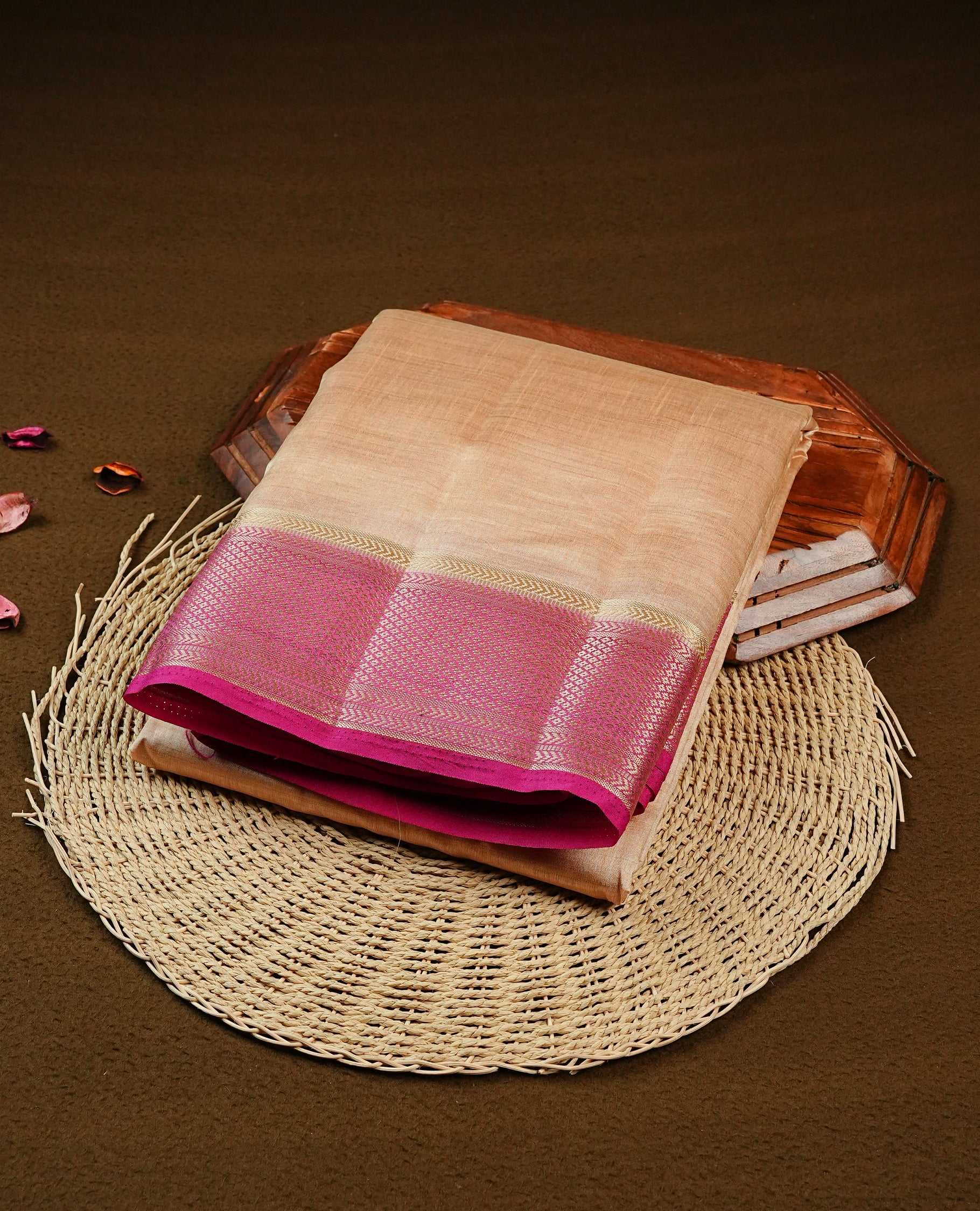 Light Gold Tussar saree featuring Gold zari buttas on body, complemented by contrast Magenta Colour with Gold zari border, comes with matching blouse piece.