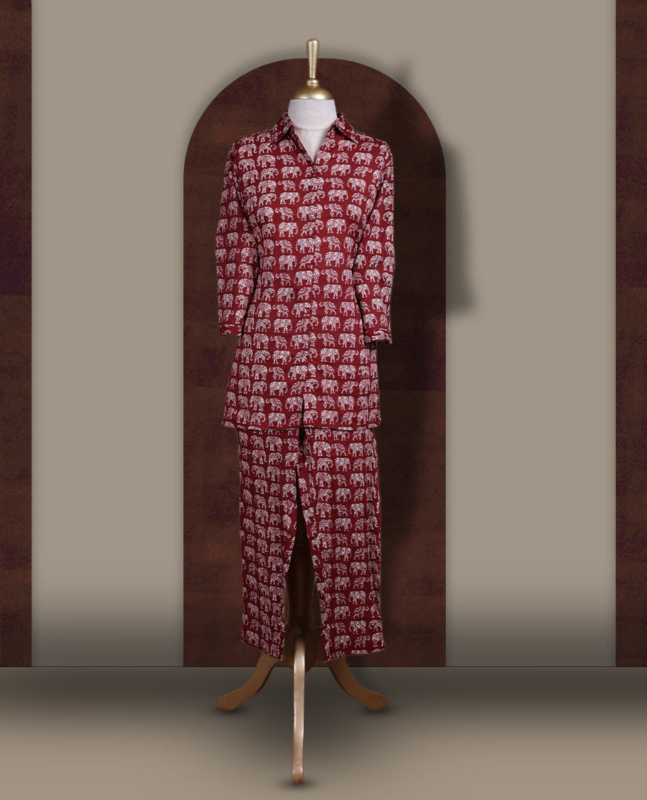 Maroon colour cotton coord set featuring charming elephant prints all over, Designed with a classic shirt collar and 3/4 sleeves, paired with matching straight pants for a trendy, relaxed, and comfy everyday look.