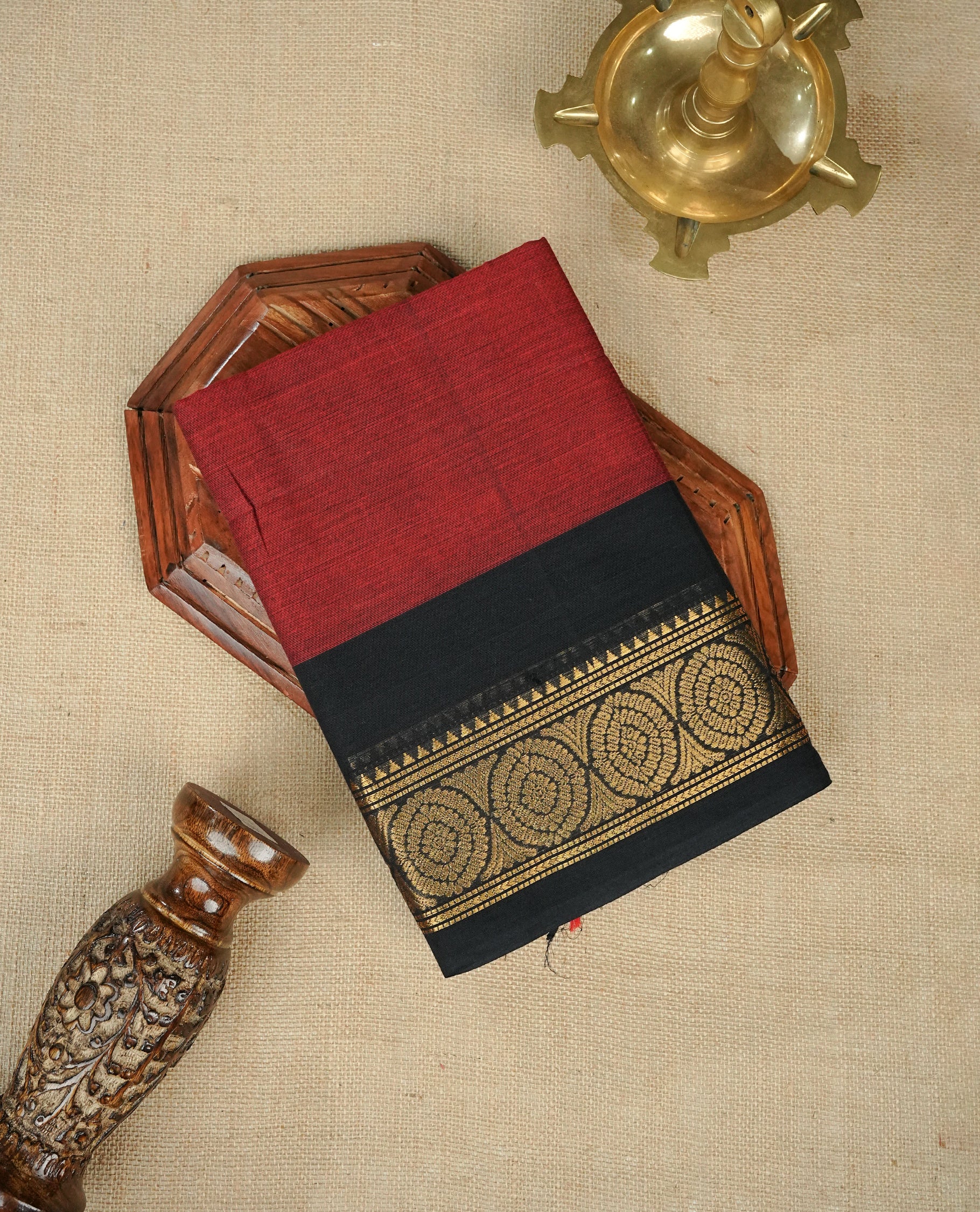 Brick Red Colour Chettinad Cotton Saree Featuring a Plain Body, Complemented by a Black Colour Border with Gold Zari & Contrast Striped Pallu, Paired with a Matching Blouse Piece.