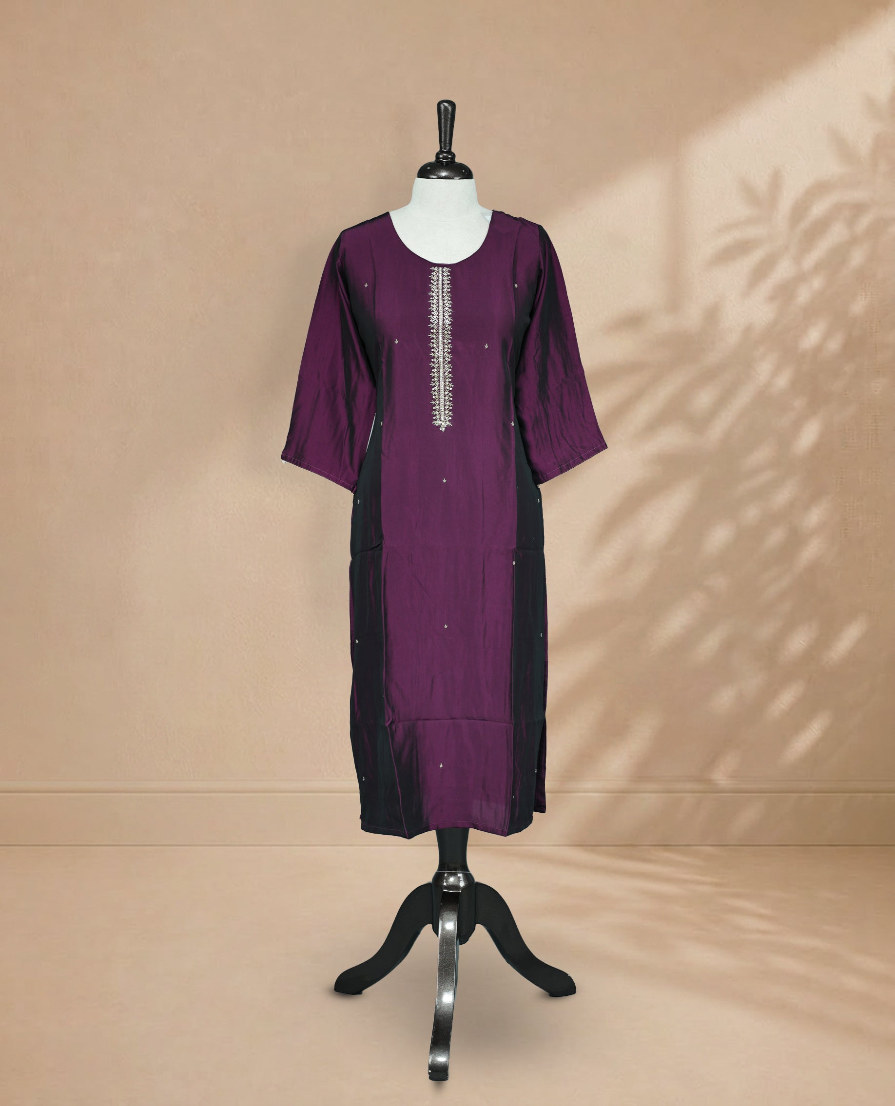 Purple Colour Kurti featuring beadwork across the body, a U-shaped neckline adorned with bead and Stone work and a 3/4 Sleeve With A Matching design.