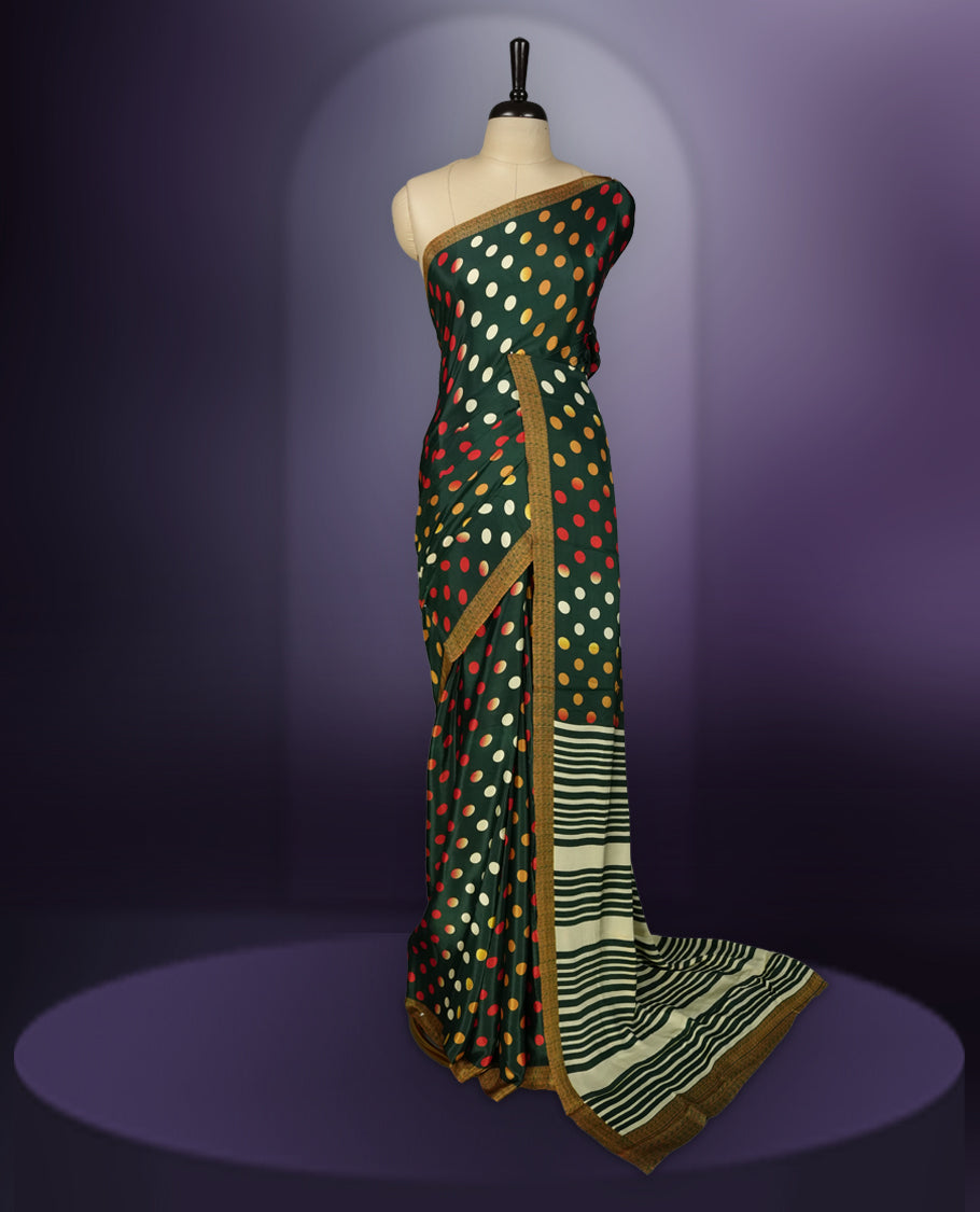 Green colour saree with with large big polka dots on the body, self stripped pallu & Comes with a stylish matching blouse.