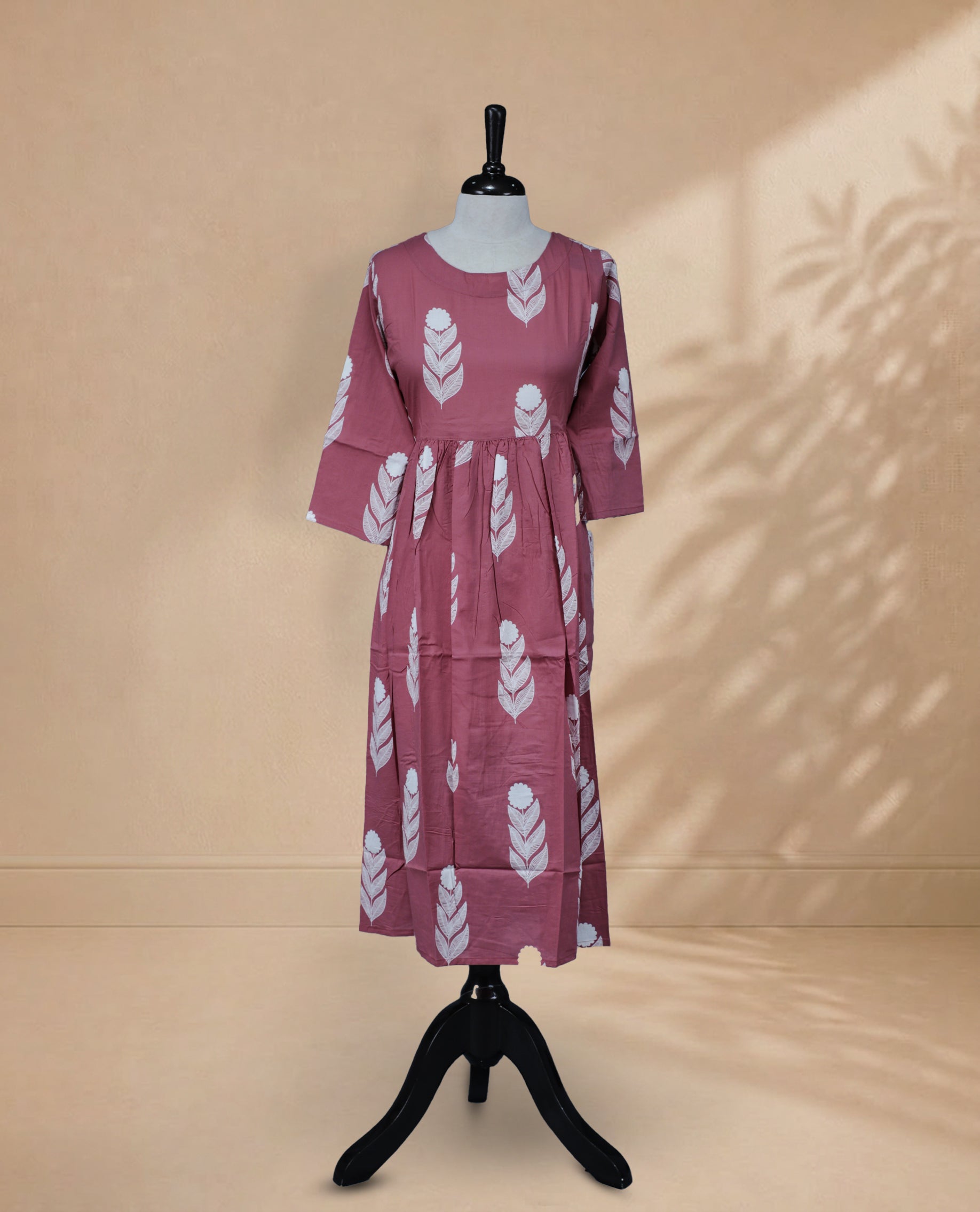 Dusty Rose kurti featuring a classic U-shaped neckline, White Floral Prints on the body, and sleeves.