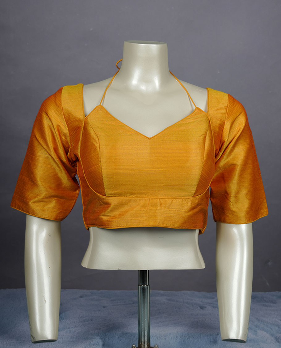 Golden yellow colour silk padded readymade blouse with elbow-length sleeves, a V-neck front, and a deep U-back with tie-up dori.