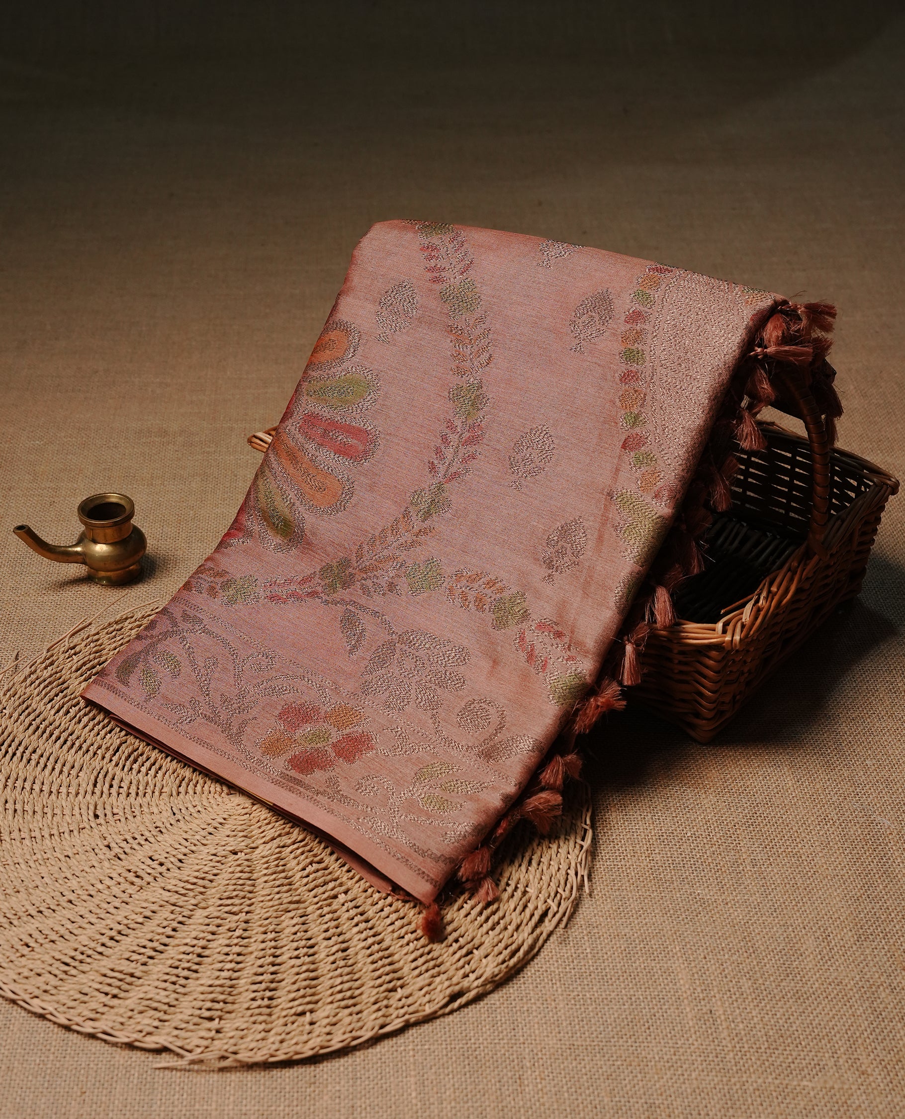 Peach colour pure tussar silk saree featuring elegant antique zari kodi patterns across the body, designed with a graceful borderless finish for a refined look. Paired with a matching blouse piece.