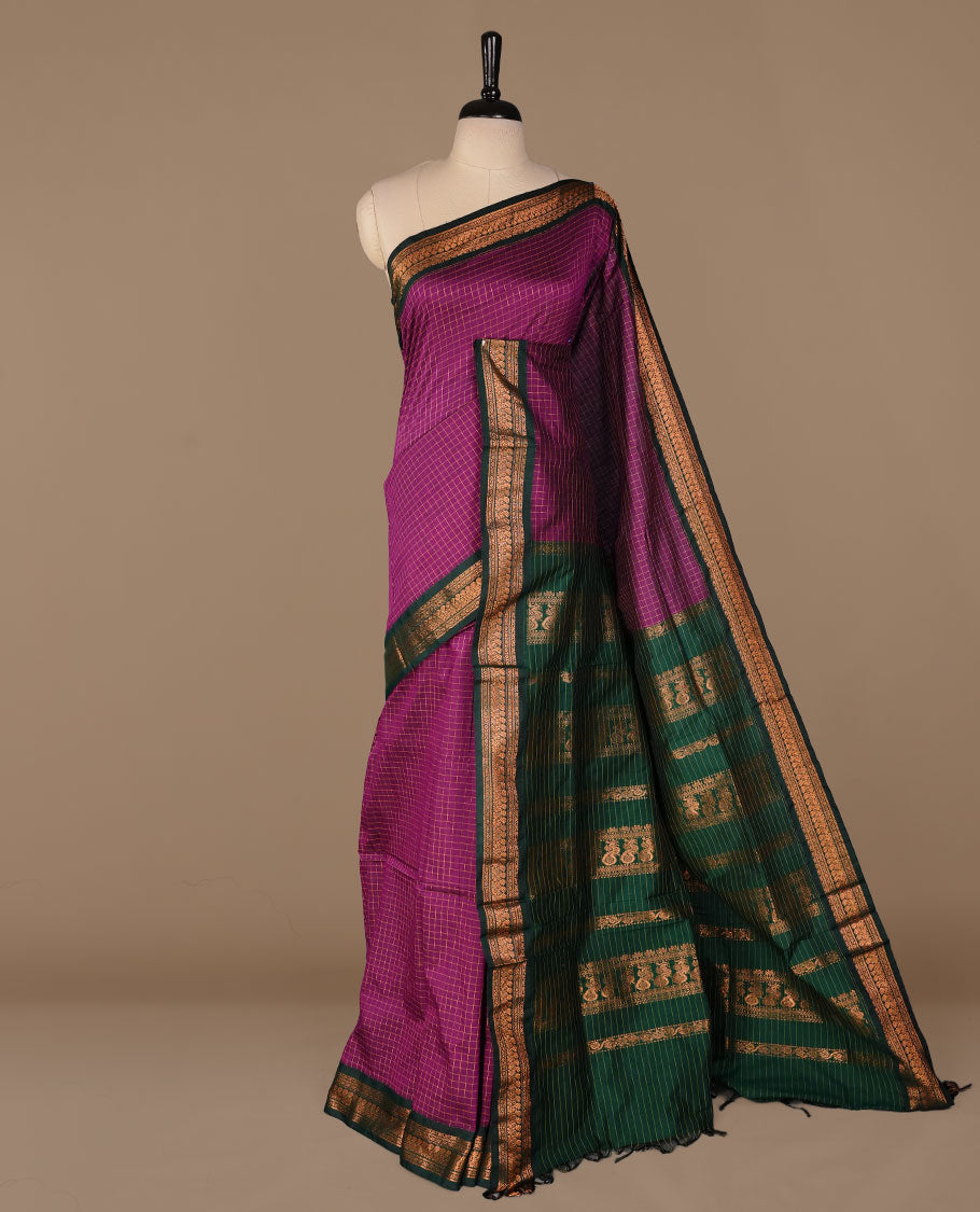 Purple colour kalyani cotton saree featuring gold zari check pattern on body, complemented by green colour with Antique zari border, paired with matching blouse piece.