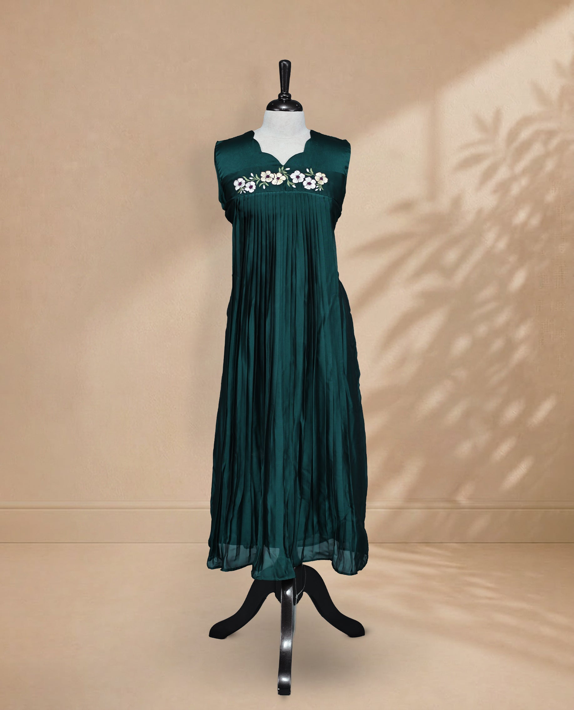 Bottle Green Coloured Sleeveless Kurti Featuring a Designed Neckline, Floral Embroidery on the Body