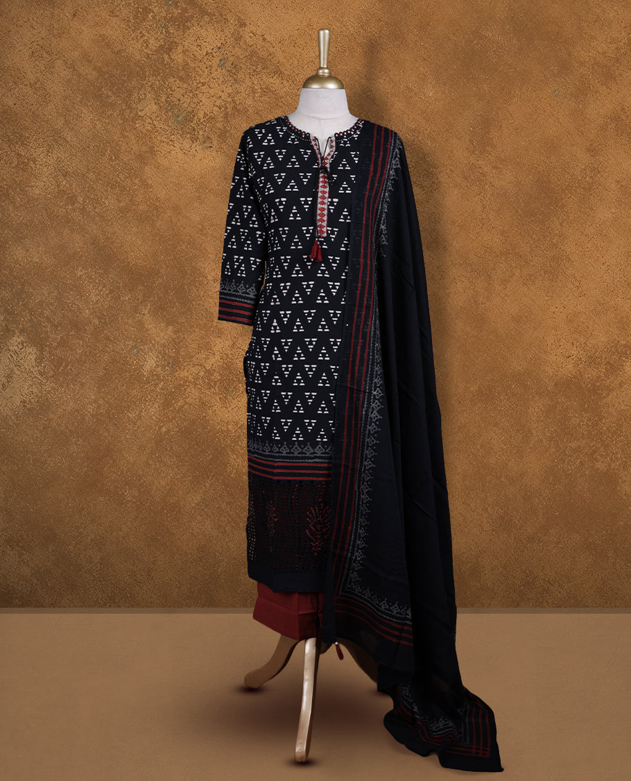 Black colour churidar set featuring thread embroidered on neckline, sleeves, and Geometeric printed pattern on body , Paired with a matching dupatta