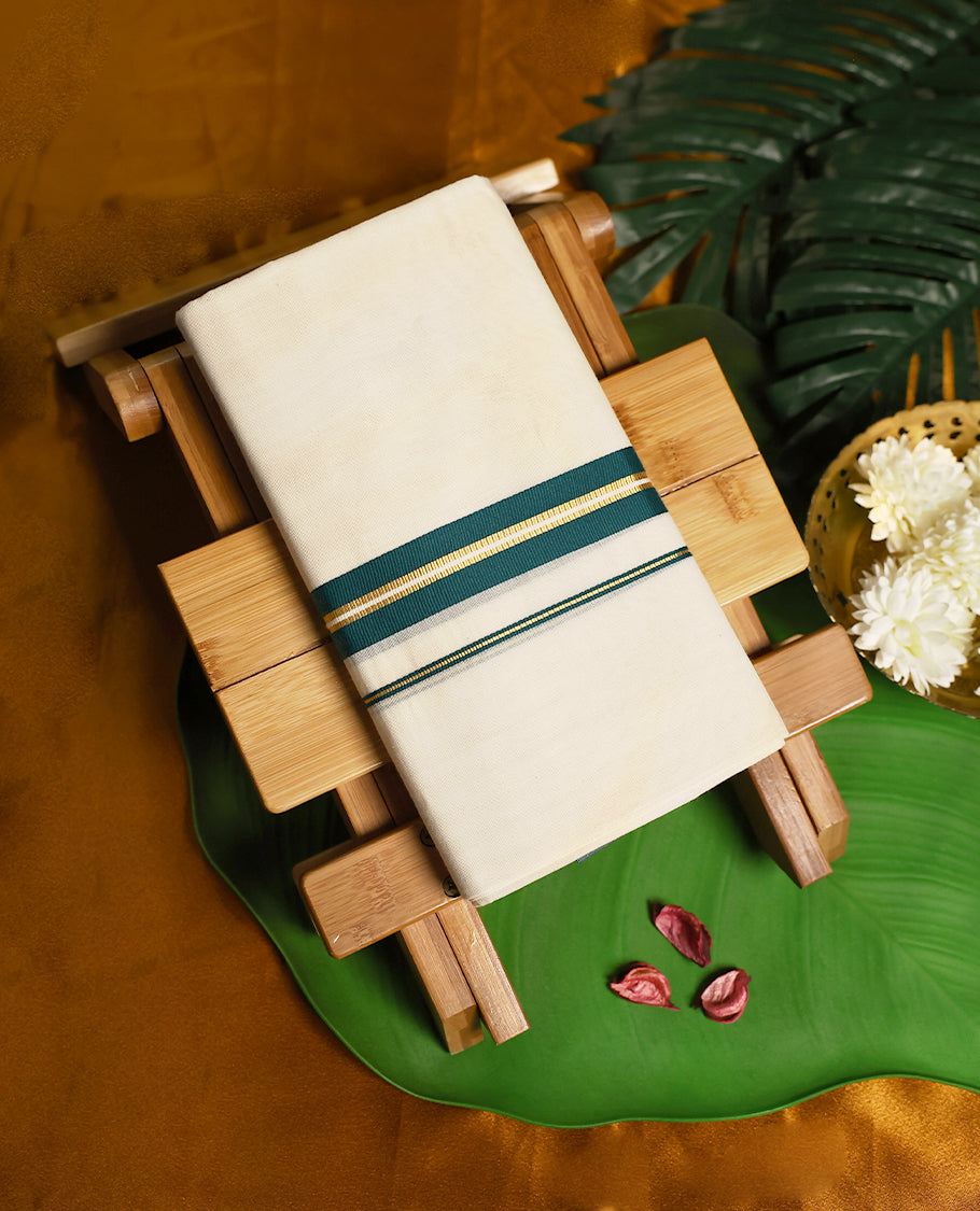 Ivory white pure cotton double dhoti designed with an elegant teal and gold zari border, blending traditional charm with breathable comfort, perfect for festive and cultural occasions.