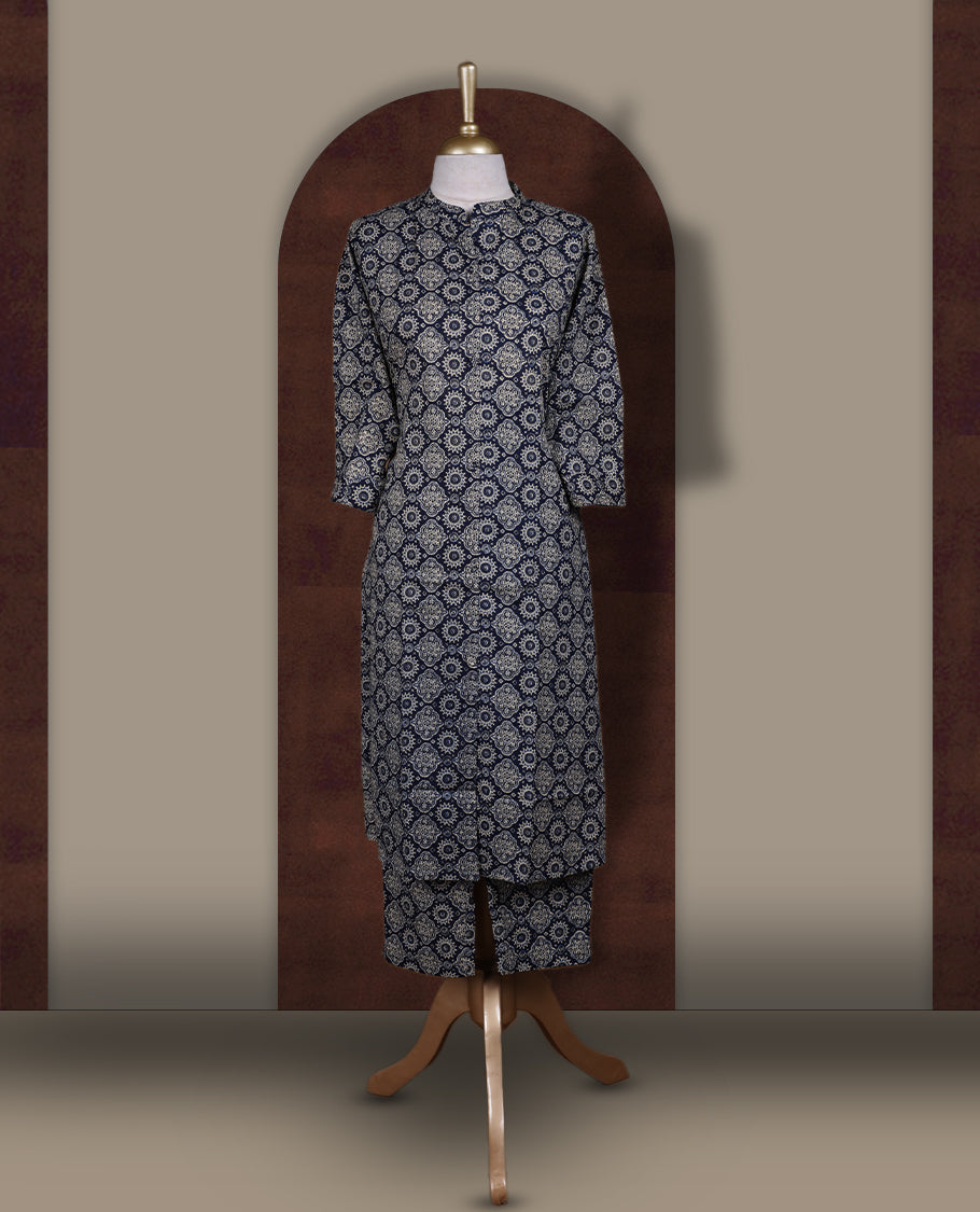 Navy blue colour coord set with floral prints all over, featuring a smart mandarin collar and 3/4 sleeves, Paired with matching straight pants, it blends elegance and comfort for a chic everyday or casual outing look.