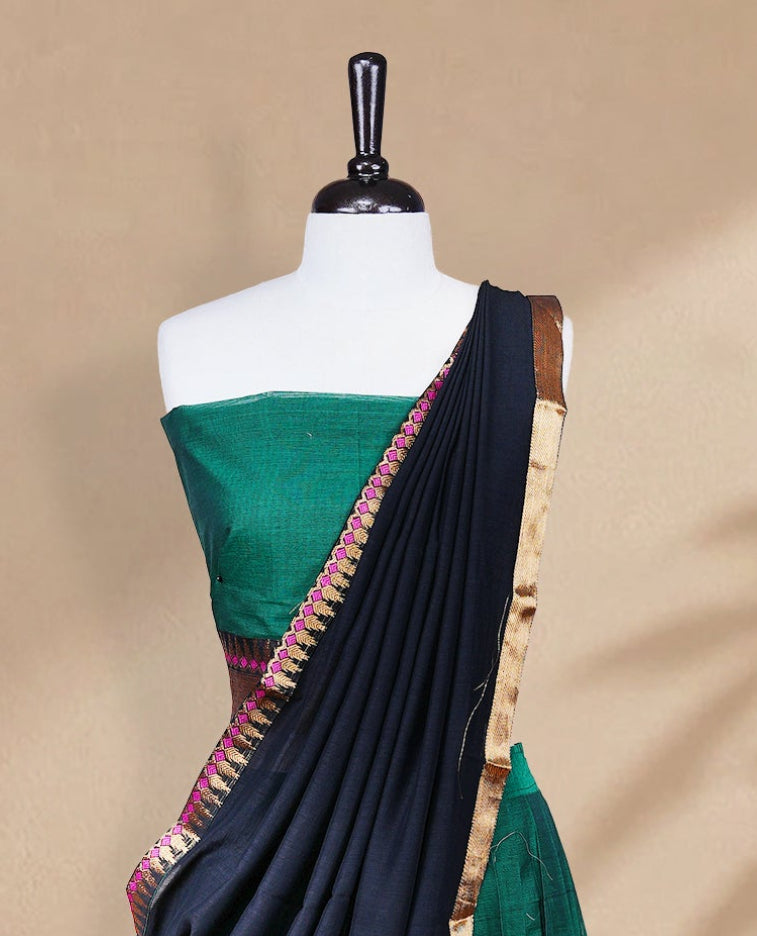 Green colour Half saree featuring Plain skirt with Zari border on contrast black colour border, Unstitched Blouse and matching dupatta.