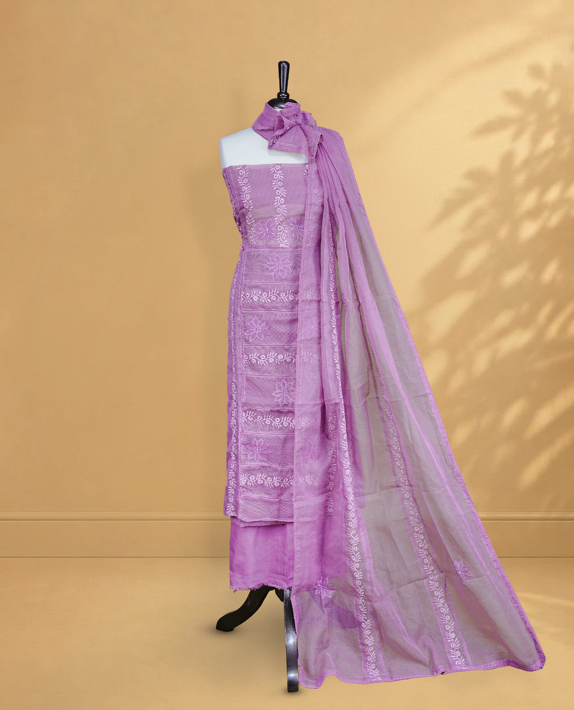 Purple colour Salwar material featuring Self colour Floral Thread pattern, Matching bottom and paired with Same colour with thread patterned Dupatta.