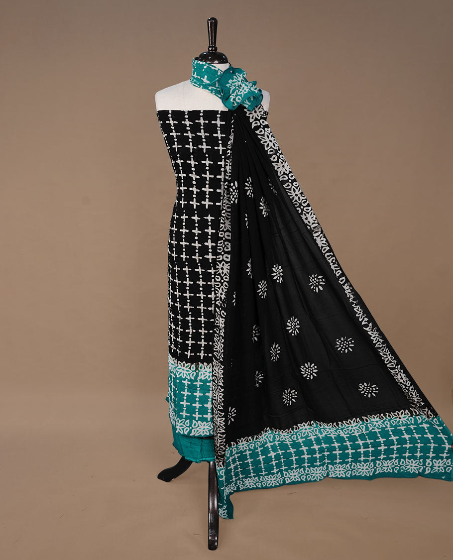 Green and Black colour churidhar material featuring cream colour floral kodi print on body, paired with matching bottom and Dupatta.
