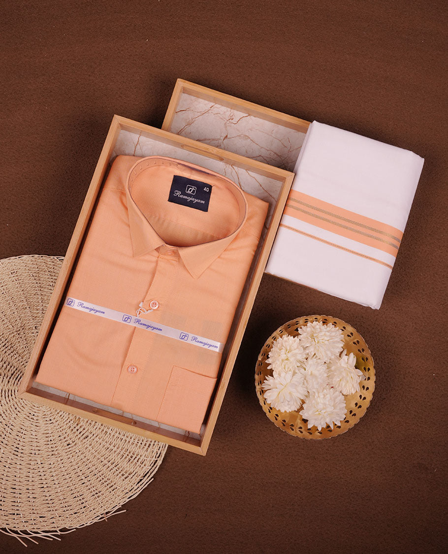 Light orange Colour shirt paired with a matching dhoti, finished with a Light orange and gold border.