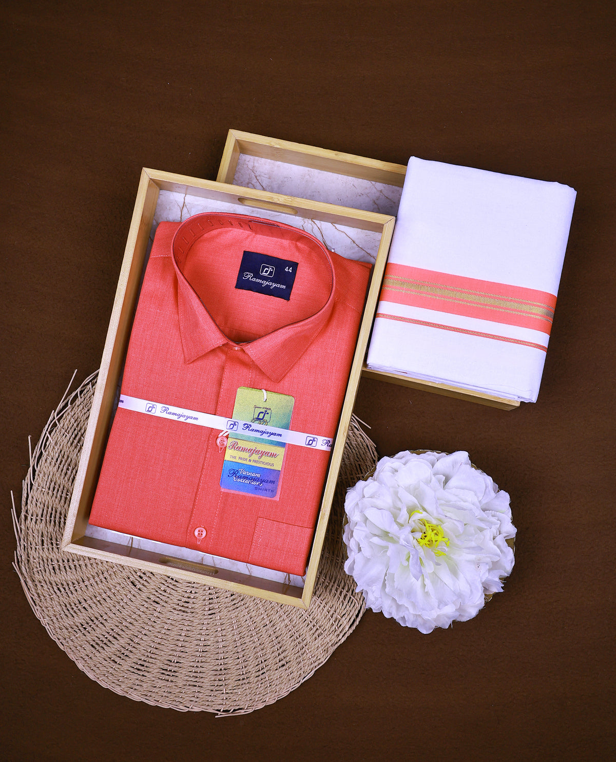 Coral pink colour RAMAJAYAM shirt paired with a matching dhoti, finishing with Coral pink & Gold kara
