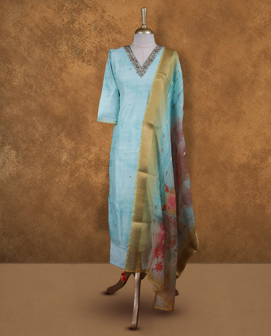 Light blue colour churidar set featuring thread and cut beats embroidered neckline, sleeves, and Gold colour motifs on body , Paired with a matching dupatta