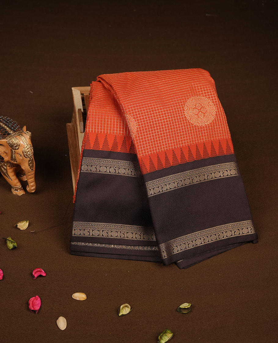 Dark Rust orange colour semi silk saree featuring gold zari checks with floral motifs on body highlighting contrast dark chocolate gold zari small mango border , paired with matching blouse