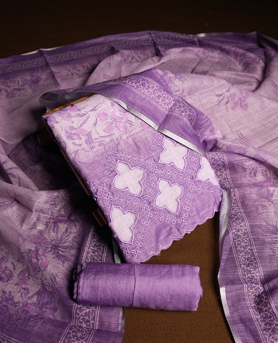 Lavender colour churidhar material featuring floral and cutwork embroidery on the front panel, digital floral printed dupatta with elegant border, and matching plain bottom.