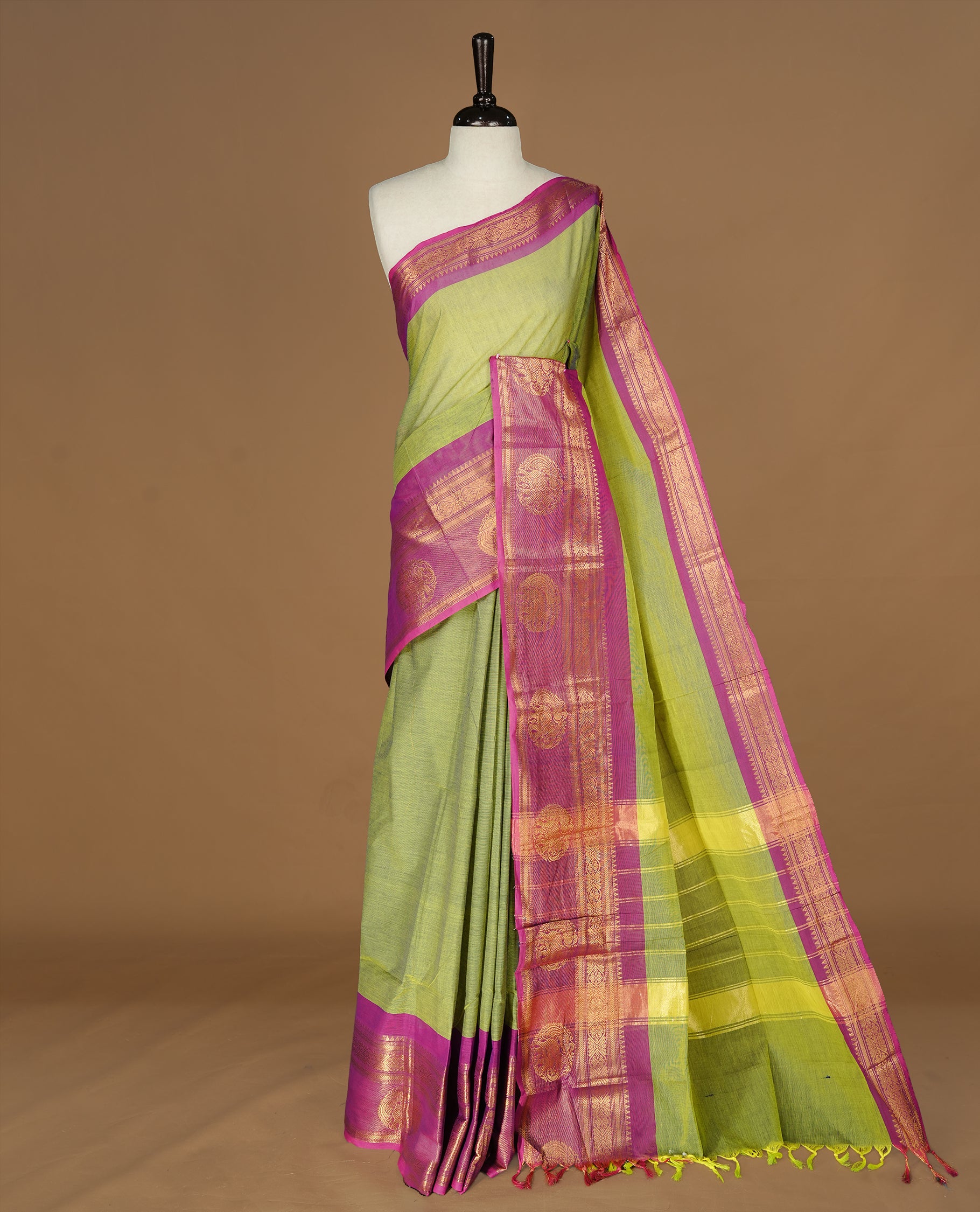 Olive Colour Chettinad cotton saree featuring elegant plain body , complemented by contrast Magenta colour with traditional border, comes with matching blouse piece.