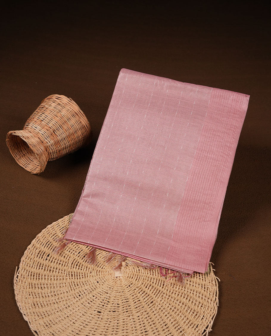 Pink colour semi jute saree highlighting gold zari stripped body with white motifs, without border and paired with matching blouse.