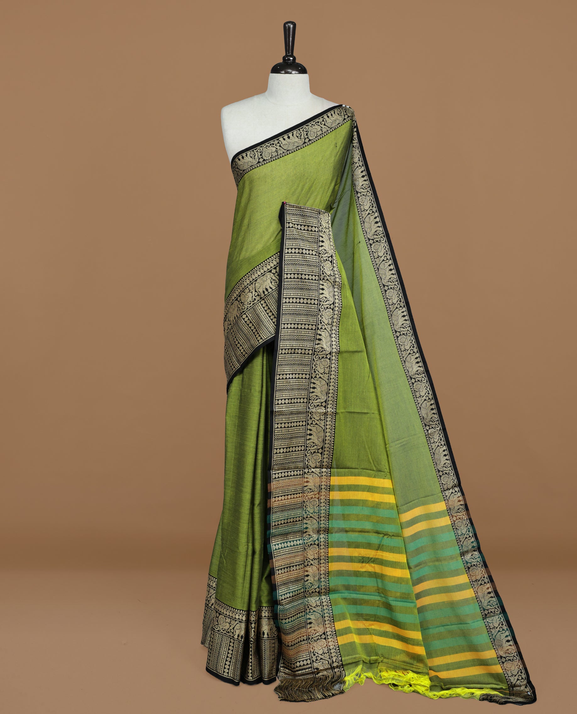 Green colour Narayanapett cotton saree Featuring Elegant plain Body, complemented by Contrast Black colour with cream zari border, paired with matching blouse piece.