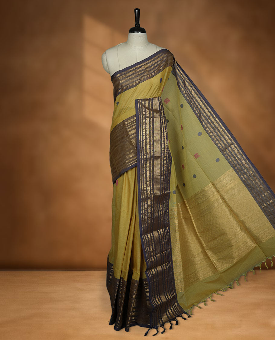 Olive colour chettinad cotton saree featuring Purple colour motifs on body, contrast purple colour border with gold zari border, pallu and paired with matching blouse.