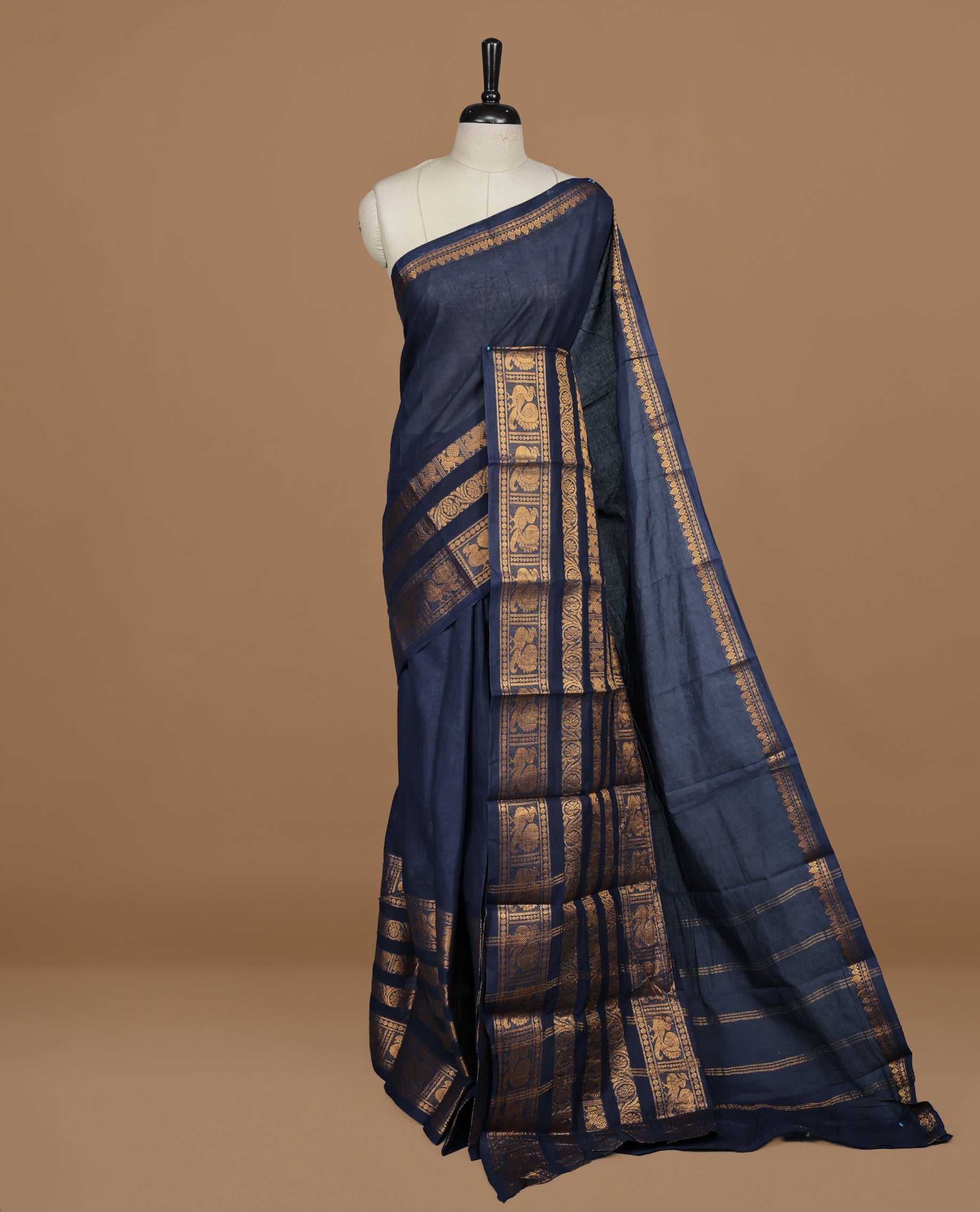 Dark Blue colour sungudi cotton saree featuring elegant plain body, complemented by Traditional border on self color , paired with matching blouse piece.