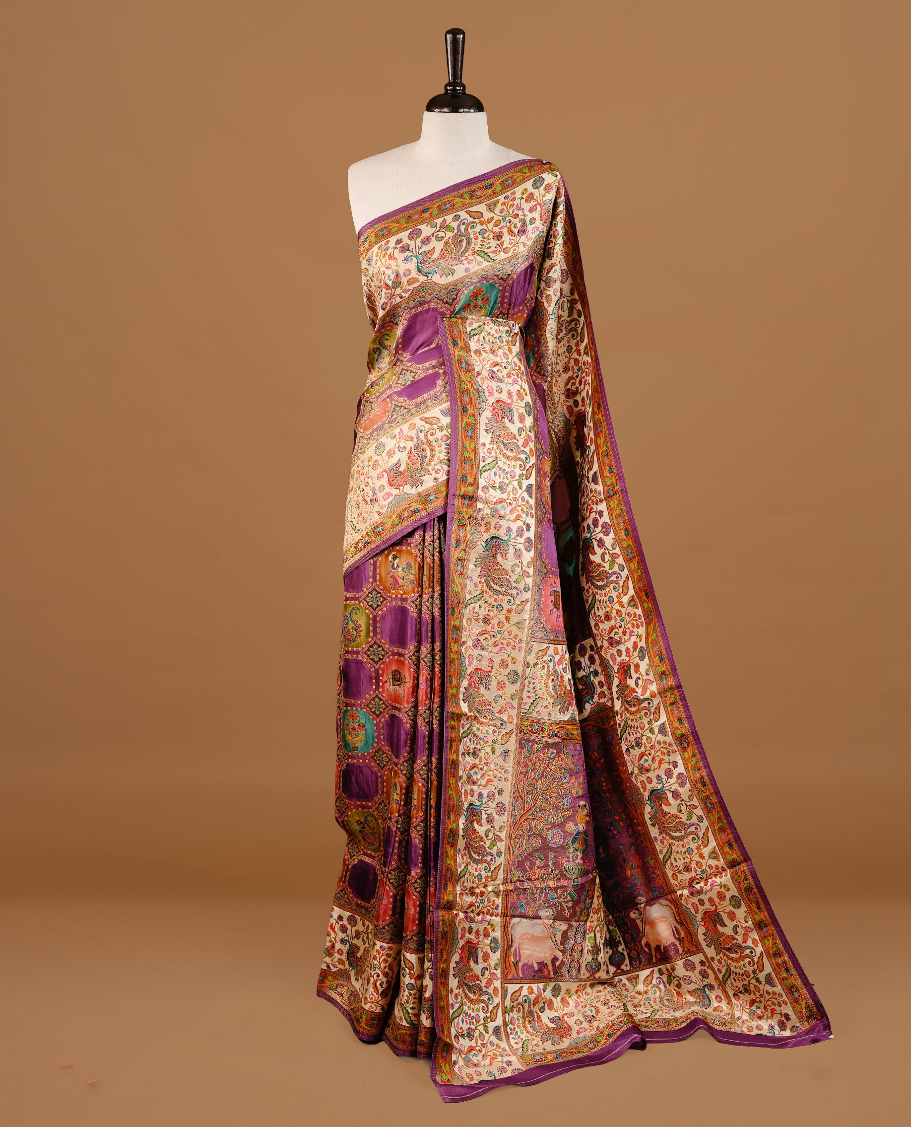 Purple colour Pashmina Saree featuring multicolour geometric and paisley woven body, a contrast multicolour floral & bird border with Purple edging, an ornate paisley woven pallu, paired with a matching blouse.