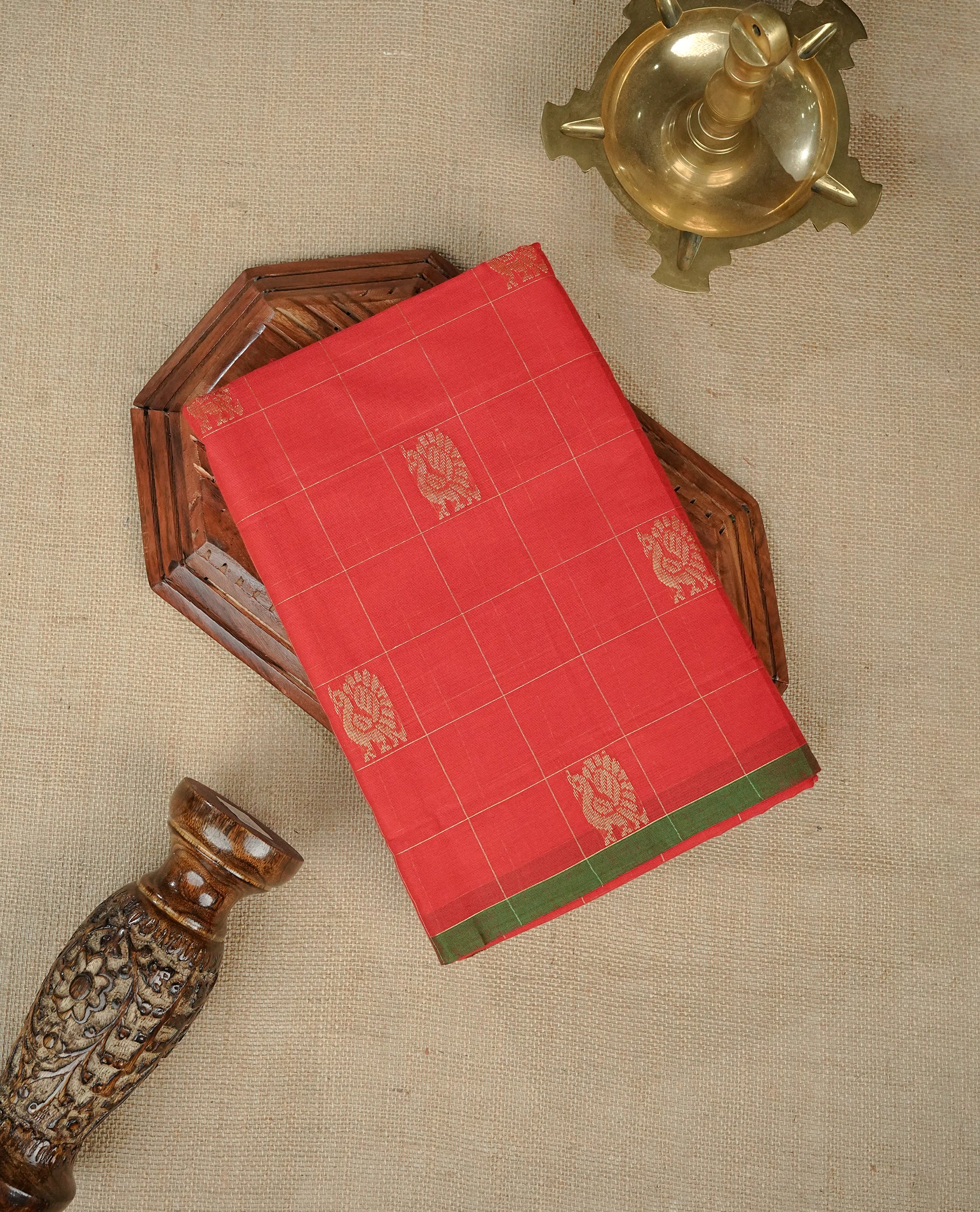 Red Colour Chettinad Cotton Saree Featuring Gold Zari Checks with Peacock Motifs on the Body, Complemented by a Minimal Green Border and a Grand Gold Zari Pallu, Paired with a Matching Blouse Piece.