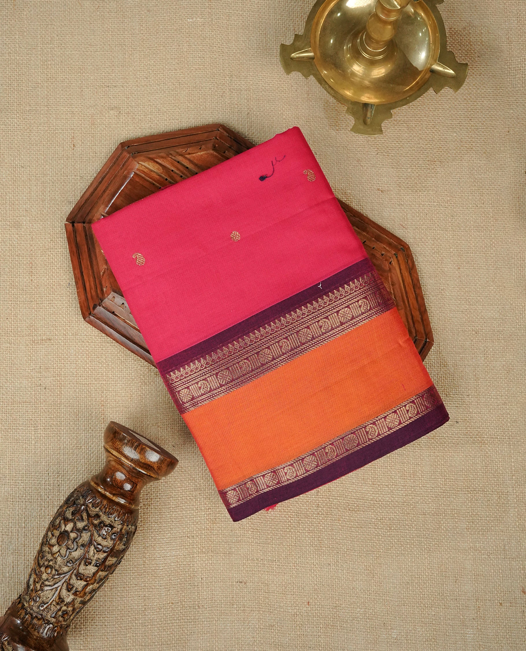 Rani pink colour chettinad cotton saree featuring gold zari motifs body, Contrast Maroon & Orange colour with Gold zari border, comes with matching blouse piece.
