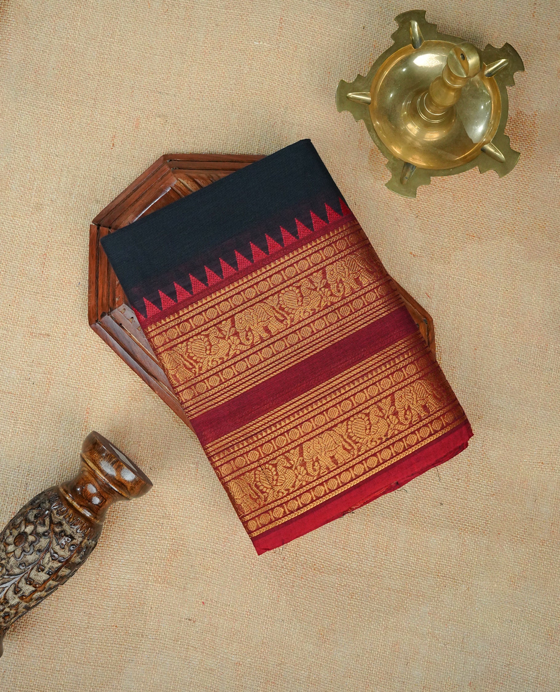 Black colour chettinad cotton saree Featuring Elegant plain body, complemented by contrast Maroon colour with zari border, comes with matching blouse piece.