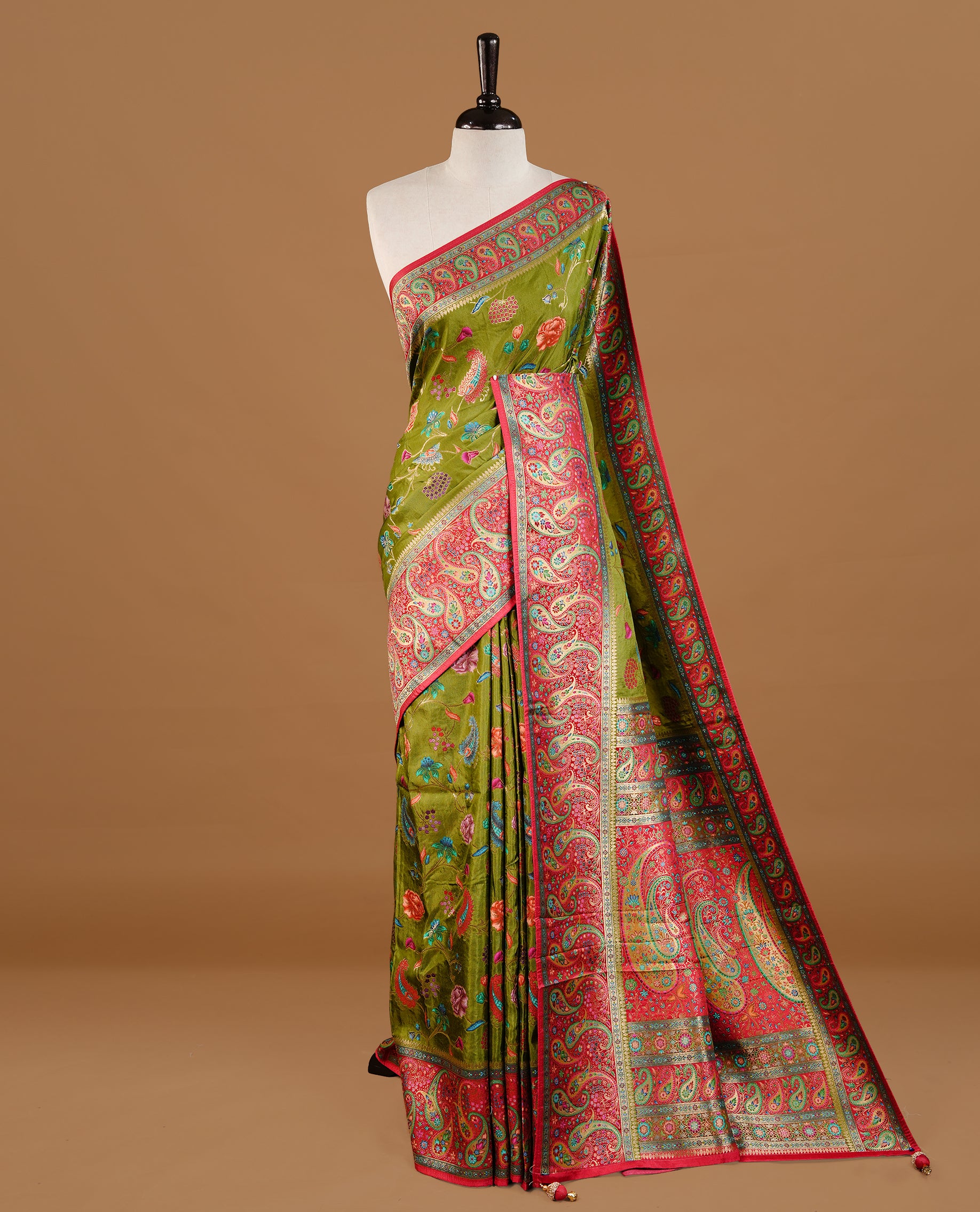 Olive Green colour Pashmina Saree featuring elegant floral and paisley woven motifs, enhanced with a contrast pink woven border and a richly detailed traditional pallu, paired with a matching blouse piece.