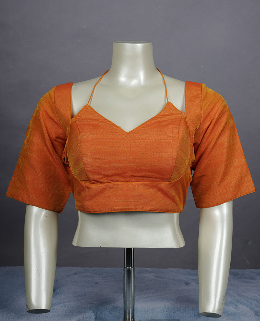 Orange colour silk padded readymade blouse with elbow-length sleeves, a V-neck front, and a deep U-back with tie-up dori.
