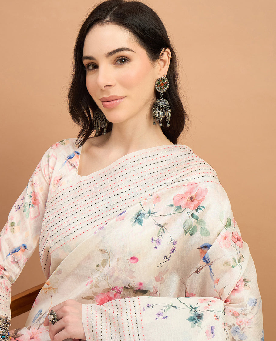 Cream toned semi tussar saree featuring delicate multicolour floral prints on the body, accented with a pastel hued Katha style stitched border and peach & green printed pallu Comes with a matching floral printed blouse for a graceful look.