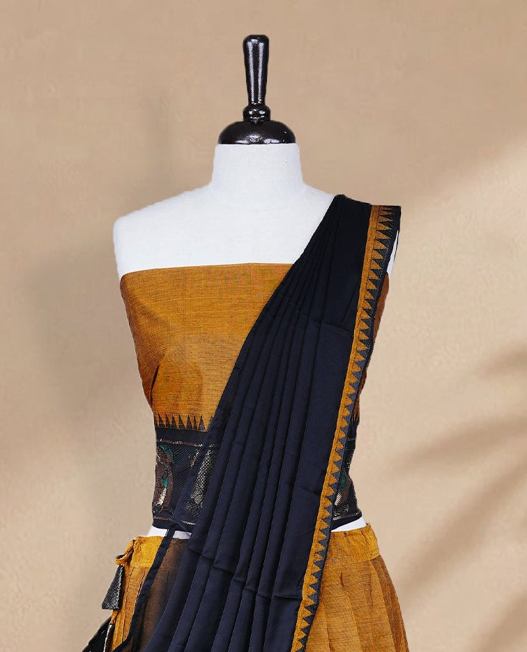 Mustard colour Half saree featuring Plain skirt with Zari border on contrast black colour border, Unstitched Blouse and matching dupatta.