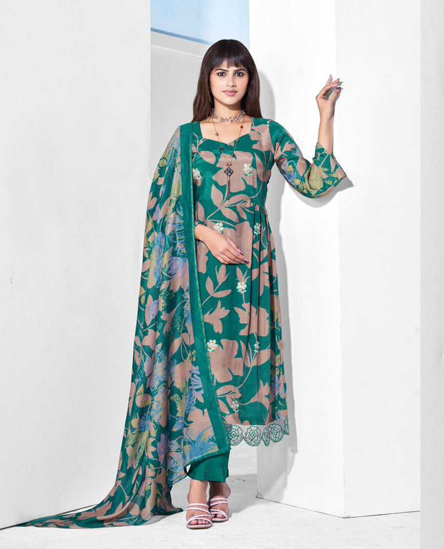 Deep teal colour suit set with a pure muslin digital printed top featuring sequin butti embroidery and a scalloped floral embroidered border, paired with a dyed pure viscose muslin bottom and a digital printed dupatta.