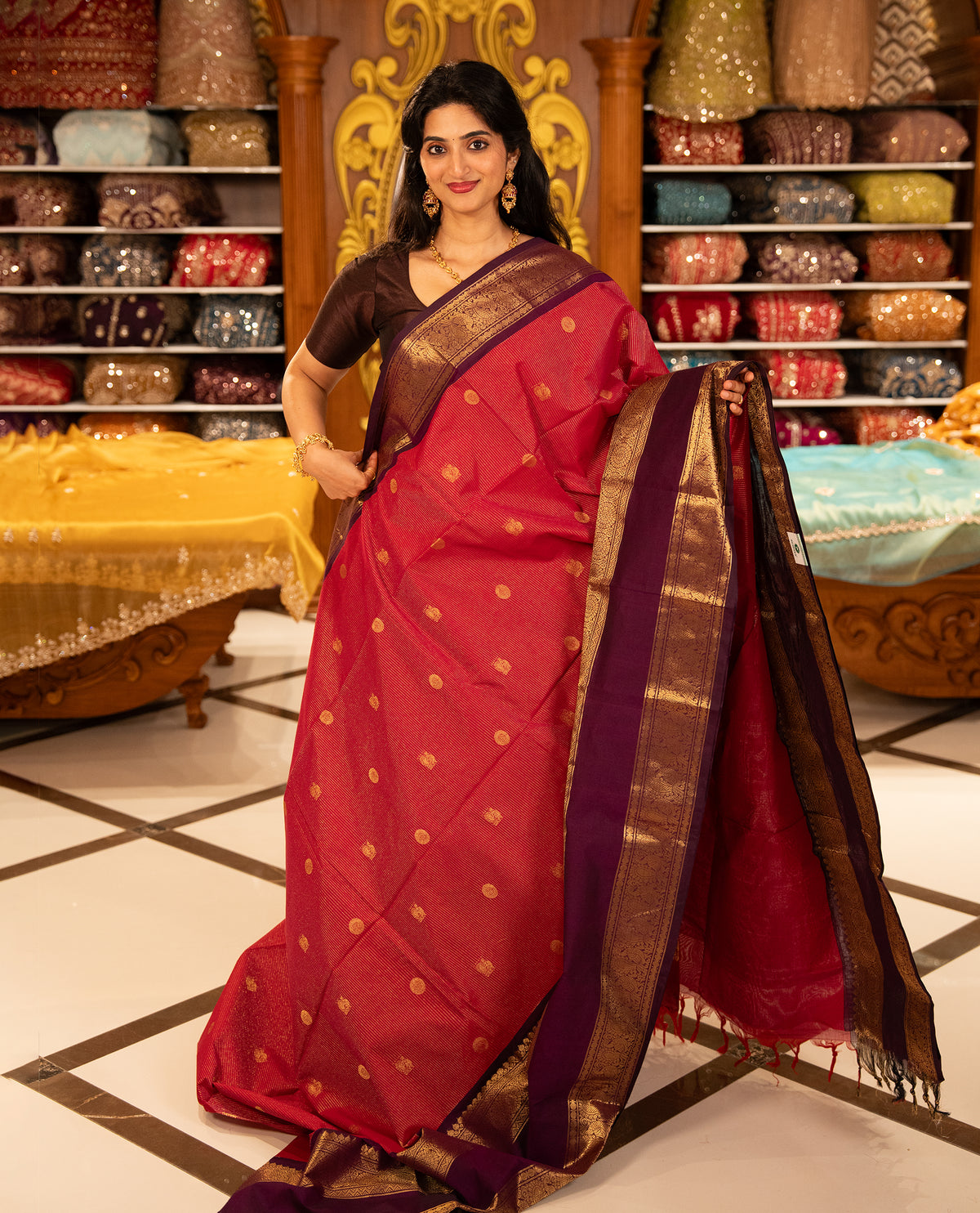 Magenta with Purple Chettinad cotton saree featuring Gold zari strips with peacock motifs on body, complemented by contrast colour border with zari design & grand pallu, comes with matching blouse piece.